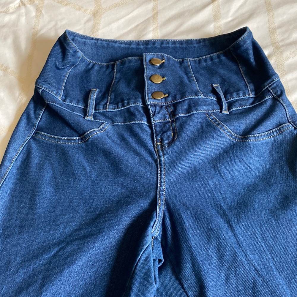 High waisted blue jeans.
